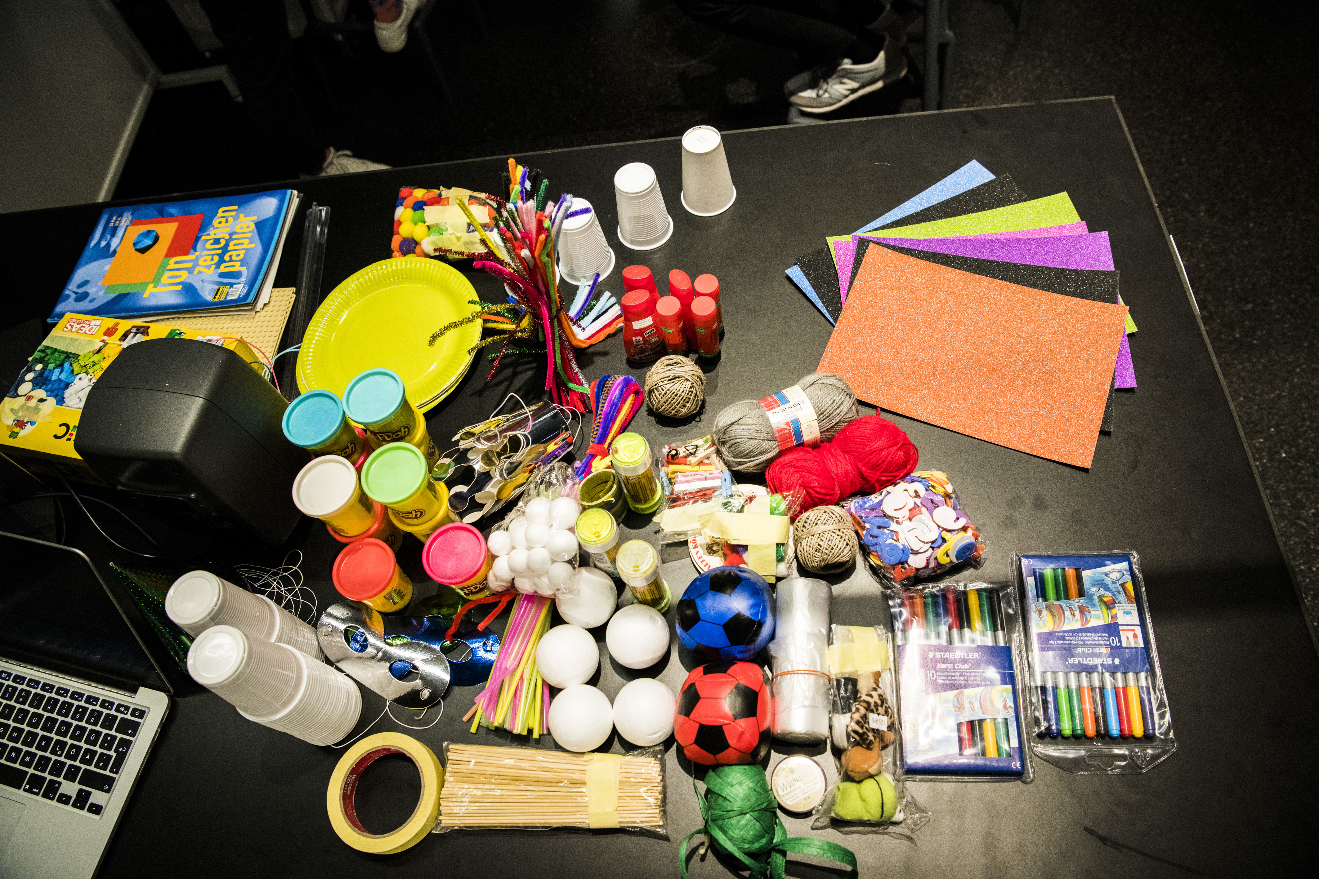 Craft materials lie on a table